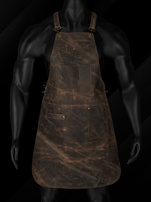 Handmade black pullup leather chef apron with adjustable cross-back straps and brass hardware, featuring multiple utility pockets. Ideal for grilling, hairstyling, and workshop tasks. Personalized apron with custom initials or logo, suitable for chefs, barbers, butchers, or craftsmen. Durable A+ grade leather workwear apron, perfect gift for Dad or professionals.