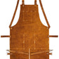 Back view of Ironhide Leather Apron showing cross-back adjustable straps and heavy-duty hook loops for support and wearability. The durable craftsmanship makes it a reliable apron for shop work, blacksmithing, grilling, and more. Great for those needing a rugged and functional apron with plenty of tool storage options.

