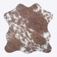 Close-up image highlighting the hair-on cowhide texture and natural animal print variations, emphasizing luxury craftsmanship and rustic aesthetic for drink protection.

