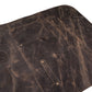 Close-up image of handcrafted pullup leather chef apron, focusing on leather texture, reinforced stitching, and brass buckle detailing. Captures premium craftsmanship, ideal for showcasing personalization area. Great for chefs, BBQ pros, and hairstylists looking for functional and elegant workwear.

