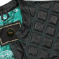 Close-up image of the satin lining inside the Turquoise Diamond Stitched MC Club Vest. Highlights premium craftsmanship, turquoise diamond stitched leather exterior, and brass zipper closure. Designed for motorcycle club members, road warriors, and bikers. Customizable with patches, colors, and concealed carry option. A rugged yet stylish turquoise biker vest for rebels and riders.