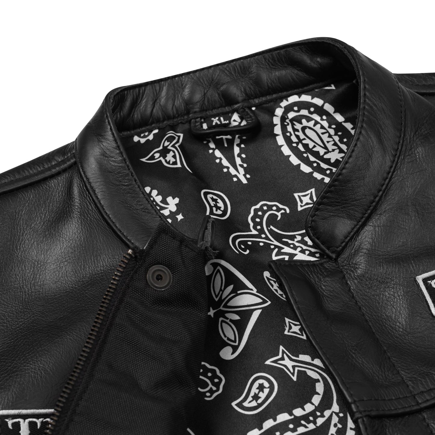 Close-up view of the premium polyester interior lining inside the custom embroidered black cowhide leather MC vest. Highlights neat stitching, secure pocket placement, and concealed carry option. Designed for motorcycle riders and club members, this lining detail shows durability, comfort, and craftsmanship in personalized biker apparel.