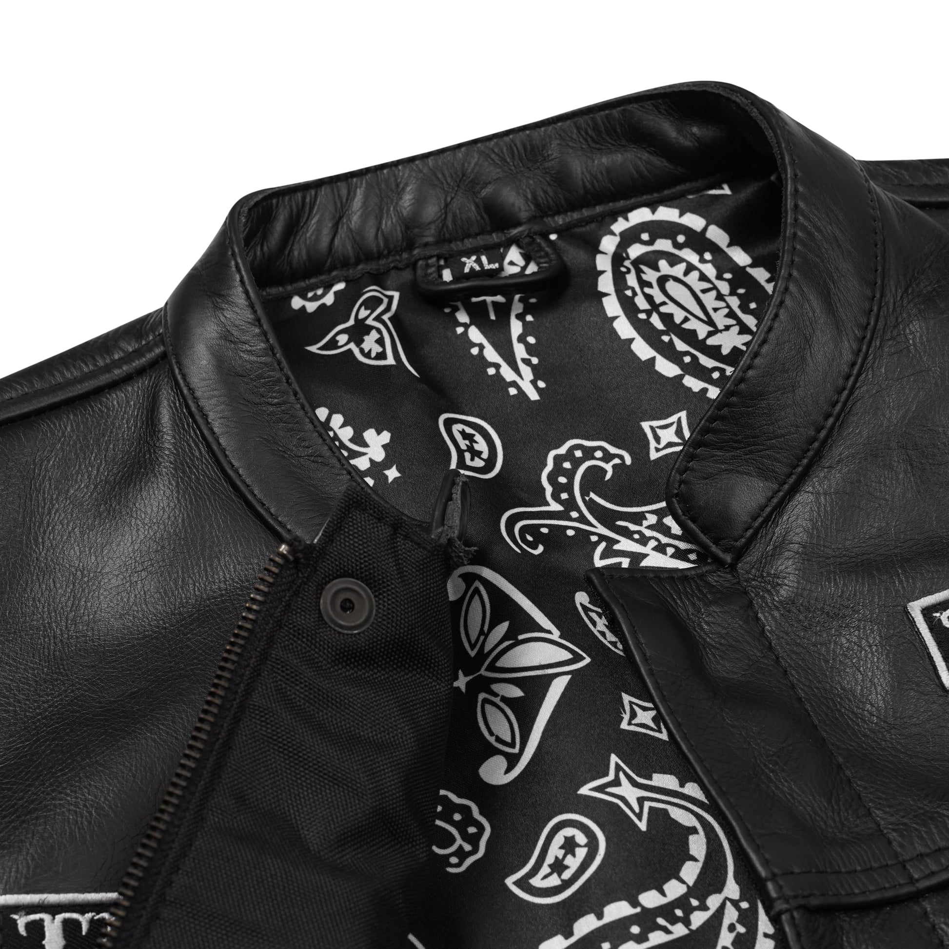 Close-up view of the premium polyester interior lining inside the custom embroidered black cowhide leather MC vest. Highlights neat stitching, secure pocket placement, and concealed carry option. Designed for motorcycle riders and club members, this lining detail shows durability, comfort, and craftsmanship in personalized biker apparel.