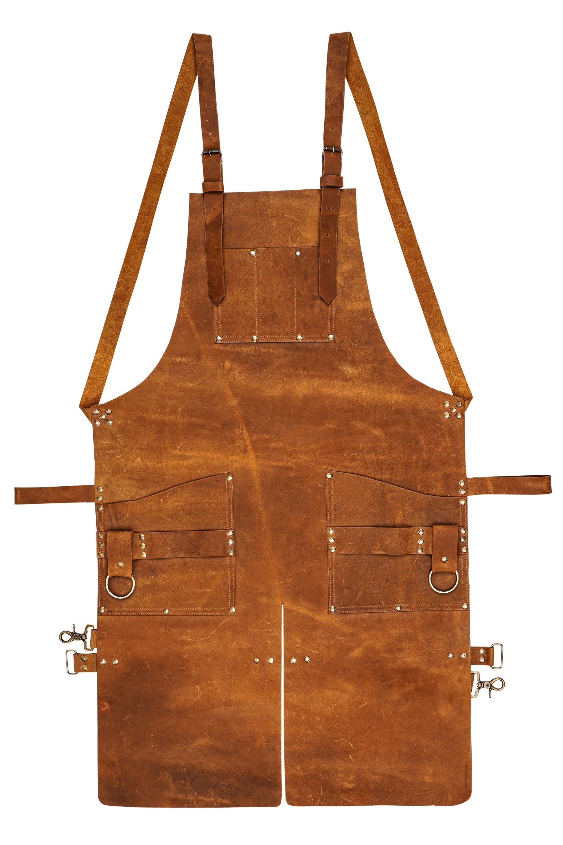 Detailed close-up of Ironhide Work Apron’s tool loops, pockets, and textured pull-up cowhide leather. Thick leather surface and premium brass hardware reflect quality craftsmanship. Ideal for hands-on professionals and hobbyists who demand strength, comfort, and performance from their workshop gear.


