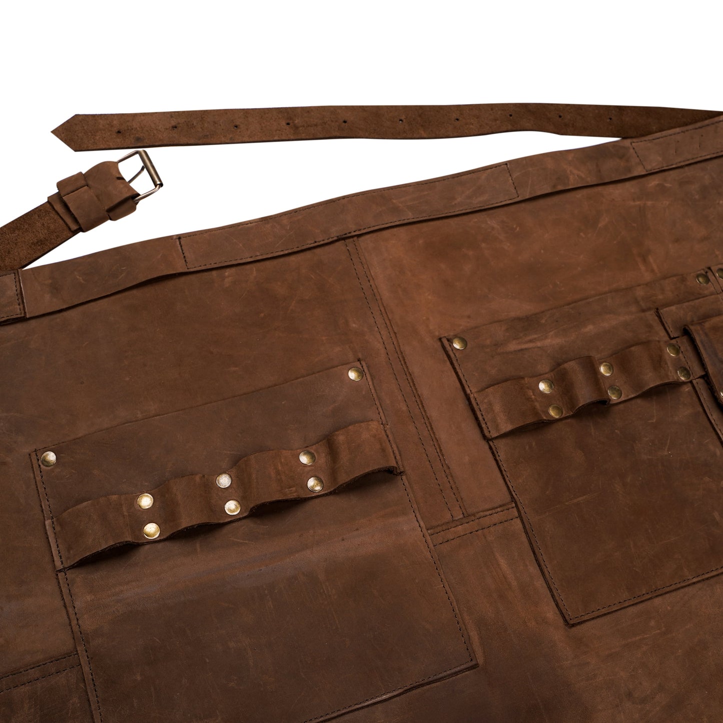 Durable half leather apron made from premium cowhide. Features brass hardware, towel loop, and multiple compartments for organizing hairstyling tools, gardening gear, or chef utensils. Designed for professionals and available with personalized engraving. A thoughtful gift for both men and women.

