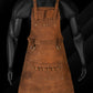 Handmade full-grain pull-up leather BBQ apron featuring adjustable leather straps, brass buckles, dual towel rings, and multiple tool pockets. Designed for chefs, barbers, grill enthusiasts, and DIY professionals seeking a durable, personalized workwear solution. Ideal as a custom gift for Dad, Mom, or any hardworking individual.

