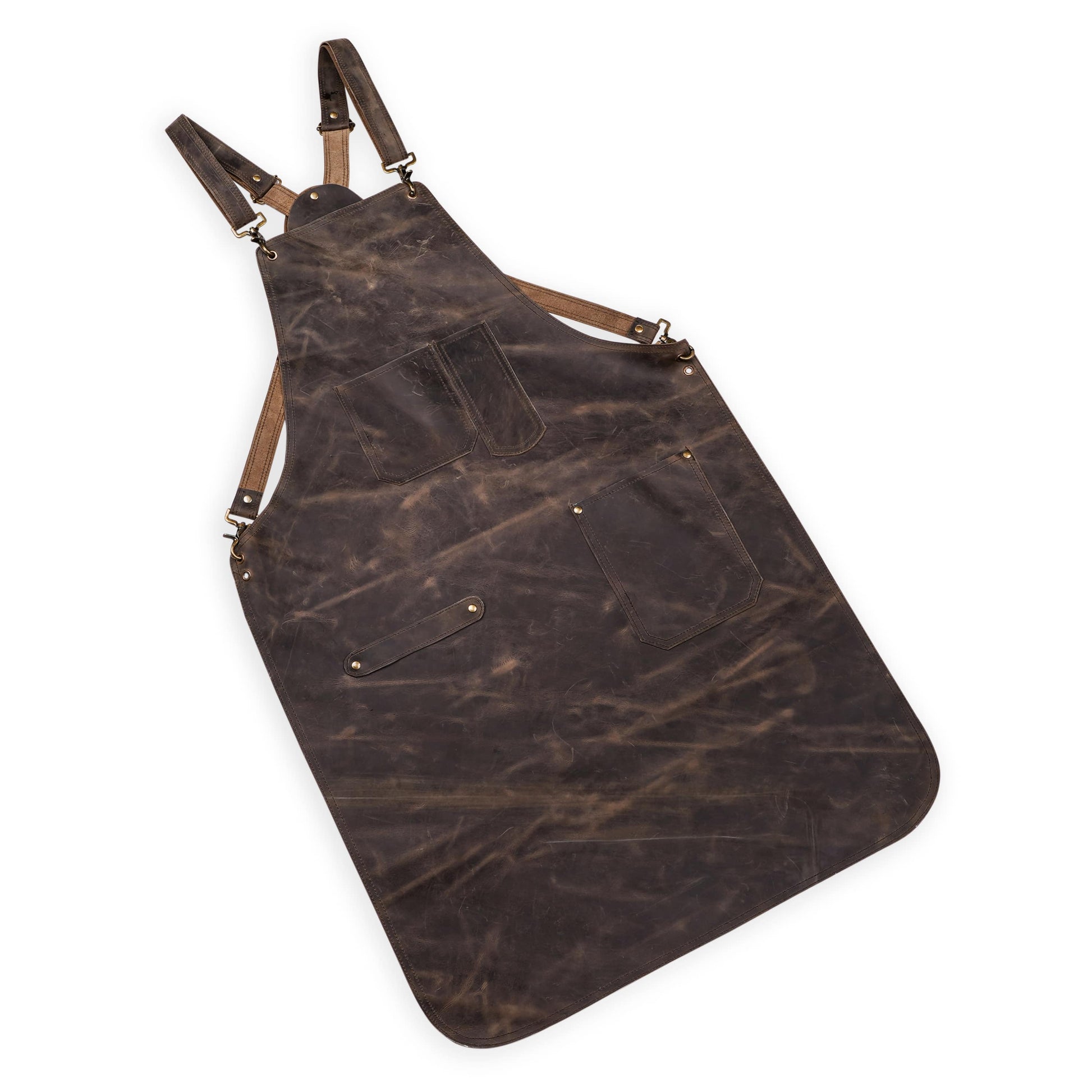 Premium handmade chef apron in pullup cowhide leather with cross-back adjustment system, towel ring, and brass hook loops. Multipurpose and highly durable for kitchen, salon, or workshop use. Personalized with logo or initials. A thoughtful and long-lasting gift for grillmasters, chefs, or hairstylists.

