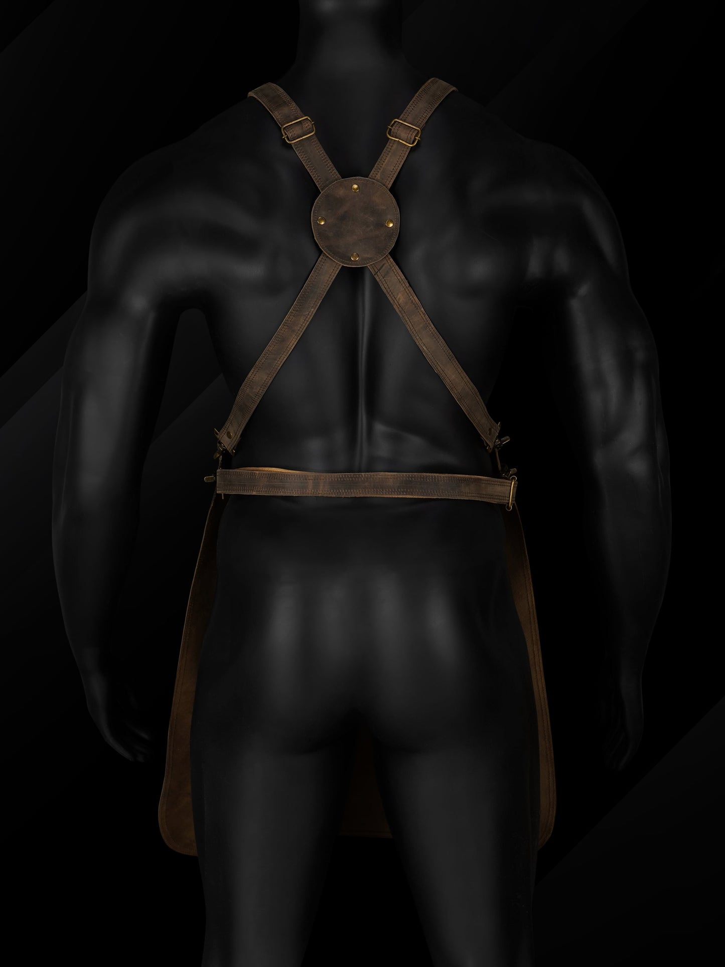 Rear view of the handmade pullup leather chef apron showcasing the adjustable cross-back leather straps, brass buckles, and reinforced stitching. Highlights ergonomic design for weight distribution and comfort during long hours of use. Ideal for professional chefs, BBQ grillers, barbers, and handymen seeking premium, functional leather workwear with a personalized fit.







