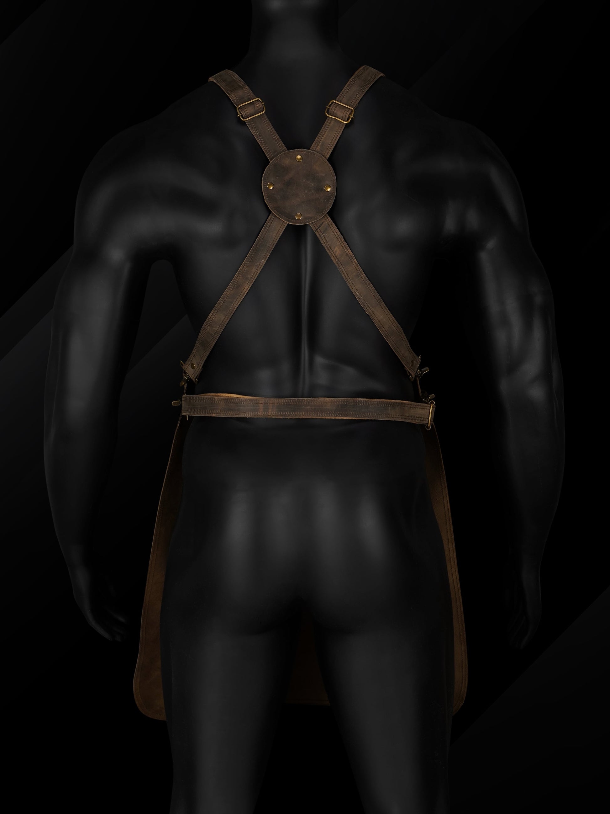 Rear view of the handmade pullup leather chef apron showcasing the adjustable cross-back leather straps, brass buckles, and reinforced stitching. Highlights ergonomic design for weight distribution and comfort during long hours of use. Ideal for professional chefs, BBQ grillers, barbers, and handymen seeking premium, functional leather workwear with a personalized fit.







